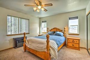 a bedroom with a bed and a ceiling fan at Big Bear Lake Cabin with Deck and Views about 9 Mi to Ski! in Baldwin Lake