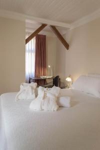 Säng eller sängar i ett rum på Hotel Boutique Casa Conde