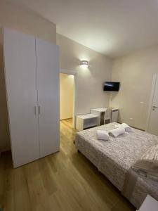 Postel nebo postele na pokoji v ubytování La maison del porto