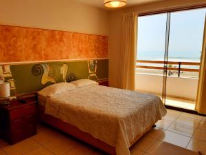 Llit o llits en una habitació de Hotel Huankarute