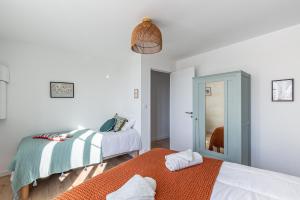 En eller flere senger på et rom på Sieck - Joli Appartement Vue mer