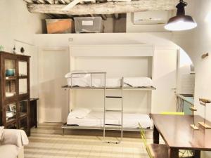 a room with a bunk bed and a table at Albarola in Monterosso al Mare
