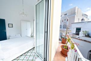 Postel nebo postele na pokoji v ubytování COCOR Capri