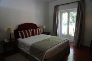 Tempat tidur dalam kamar di INATEL Castelo De Vide