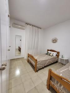 Posteľ alebo postele v izbe v ubytovaní Global Immo 8008 CASA HENDRE