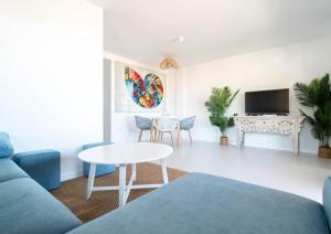 a living room with a couch and a table at Relax in Paraiso by Olax Rentals in Playa Paraiso
