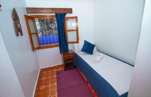 Postel nebo postele na pokoji v ubytování Hotel Al kassaba