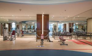 a large room with tables and chairs in a gym at Luxurious studio fully furnished 5 stars hotel facilities in Dubai South in Dubai