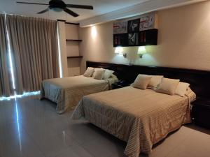 Ein Bett oder Betten in einem Zimmer der Unterkunft Hotel Mary Celaya