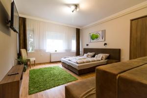 Postel nebo postele na pokoji v ubytování Thermal Garden Weninger Apartmanok