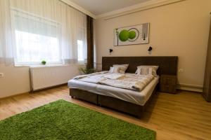 Postel nebo postele na pokoji v ubytování Thermal Garden Weninger Apartmanok