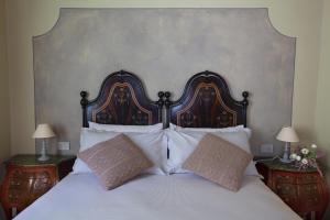 Posteľ alebo postele v izbe v ubytovaní B&B SASSO DI ROCCA