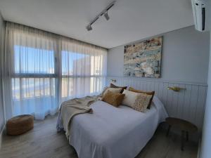 Llit o llits en una habitació de Residencias Roque Suarez