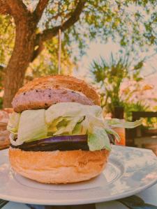 a sandwich on a plate on a table at L'Oasi Villaggio Albergo in Favignana