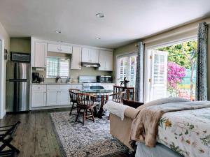 a kitchen with a bed and a table with chairs at 628 Madre Street in Pasadena