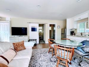 a living room with a white couch and a table at 628 Madre Street in Pasadena