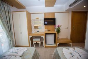 Postel nebo postele na pokoji v ubytování Hotel Aysima