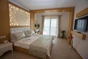 Postel nebo postele na pokoji v ubytování Hotel Aysima