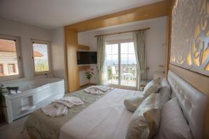 Postel nebo postele na pokoji v ubytování Hotel Aysima