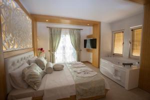 Postel nebo postele na pokoji v ubytování Hotel Aysima