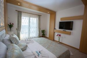 Postel nebo postele na pokoji v ubytování Hotel Aysima