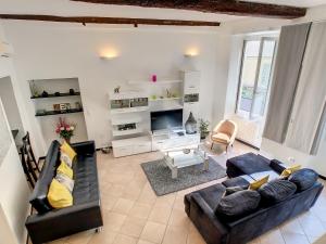 a living room with two couches and a tv at Nestor&Jeeves - ZEN - Central - Very close beaches in Nice