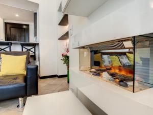 a living room with a fish tank on a wall at Nestor&Jeeves - ZEN - Central - Very close beaches in Nice +13 photos