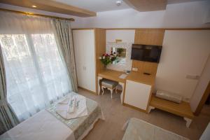 Postel nebo postele na pokoji v ubytování Hotel Aysima