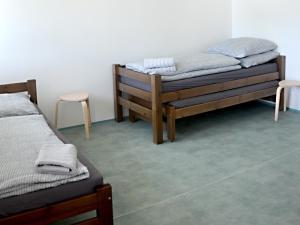 Postel nebo postele na pokoji v ubytování Ubytovna a Cykloubytovna Koupaliště Kadaň