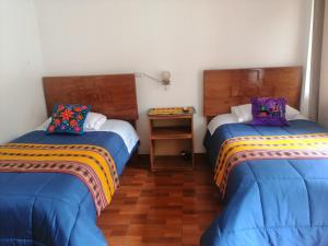 Postel nebo postele na pokoji v ubytování Kenti's Home Ollantaytambo