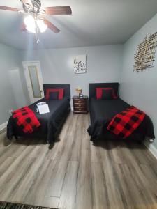 a bedroom with two beds and a ceiling fan at Spacious Atlanta 2Bedroom/ 2Full Baths Renovated in Atlanta