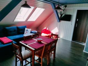 Posezení v ubytování Apartamenty TRZY PTAKI + 6 fotografií