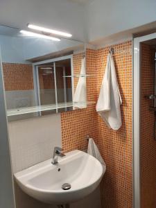 a bathroom with a sink and a mirror at Lungomare Modugno in Polignano a Mare