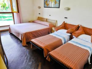 Postel nebo postele na pokoji v ubytování Albergo Bice
