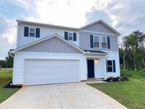 a large white house with a garage at New!!! Boiling spring - luxury home sleeps 6 in Inman