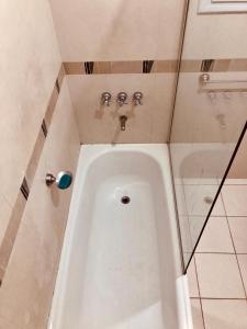 a bathroom with a urinal in the corner of a room at Descanso y Experiencias en Chacras de Coria in Ciudad Lujan de Cuyo +29 photos