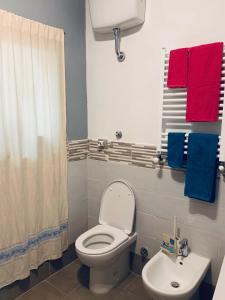 a bathroom with a toilet and a sink at Appartamento SoloSoleMare in Portovenere