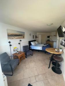 TV a/nebo společenská místnost v ubytování B&B Waddenzeetexel