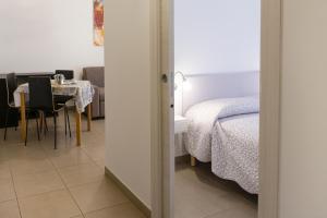 Postel nebo postele na pokoji v ubytování Melibi - Re Lear Apartments