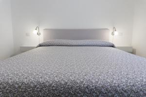 Postel nebo postele na pokoji v ubytování Melibi - Re Lear Apartments