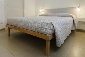 Postel nebo postele na pokoji v ubytování Melibi - Re Lear Apartments