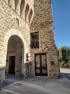 a brick building with a door and a window at La Castellana in Spina