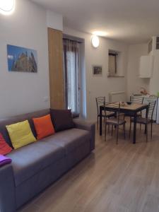 a living room with a couch and a table at La Castellana in Spina +9 photos