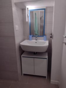 a bathroom with a sink and a mirror at La Castellana in Spina