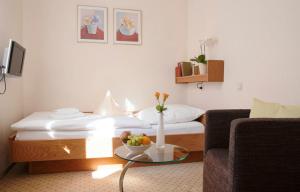 מיטה או מיטות בחדר ב-Ferien- und Wellnesshotel Waldfrieden