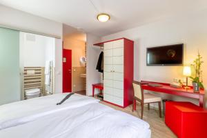 Postel nebo postele na pokoji v ubytování Hotel l'adresse garni