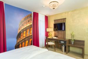Postel nebo postele na pokoji v ubytování Hotel l'adresse garni
