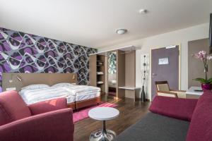Postel nebo postele na pokoji v ubytování Hotel l'adresse garni