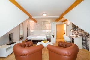 Posezení v ubytování Hotel l'adresse garni