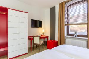 Postel nebo postele na pokoji v ubytování Hotel l'adresse garni